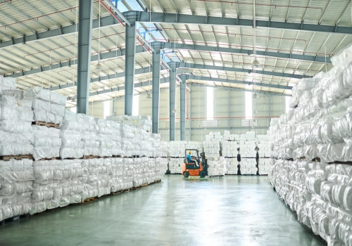 Man drives forklift in manufacturing plant